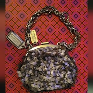 Coach leather gunmetal metallic dark silver pewter leather floral frame wristlet